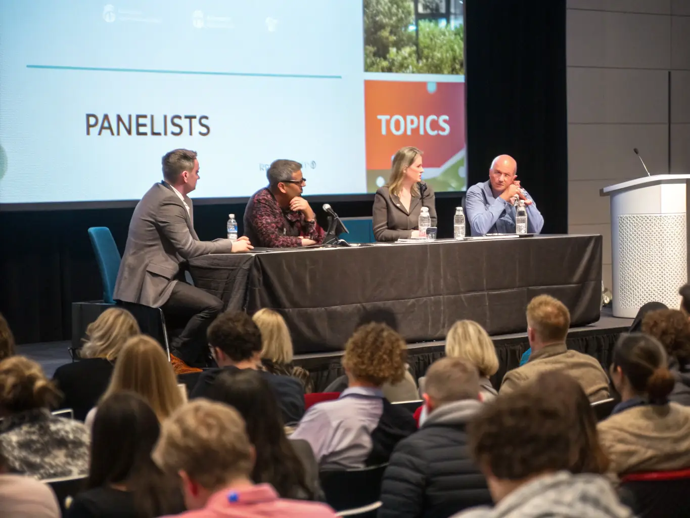 A photograph of a panel discussion featuring successful South African entrepreneurs sharing their insights and experiences at a conference in Durban.